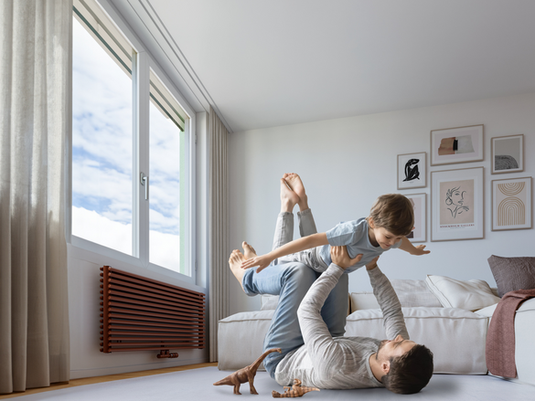 Happy young father lying on floor in living room hold fly with little preschooler son engaged in funny game together, loving dad relax playing with small boy child, enjoy family weekend at home, base iamge AdobeStock_332248000,