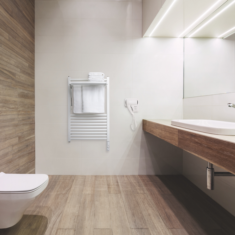 Modern public empty restroom with washstand mirror.